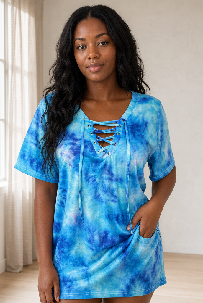 Woman in a loose tie-dye tie-front top in a bright interior