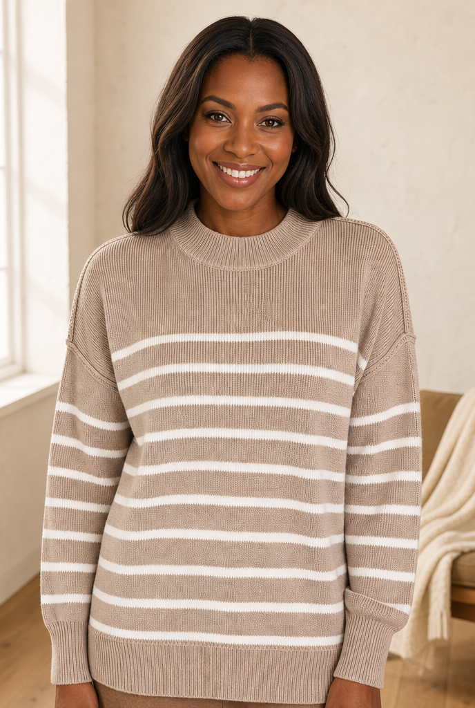 Woman in an ash mocha striped knit sweater in a warm interior