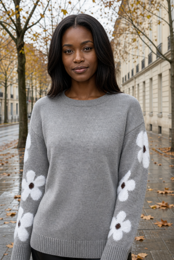 Woman in a floral knit sweater on an autumn street
