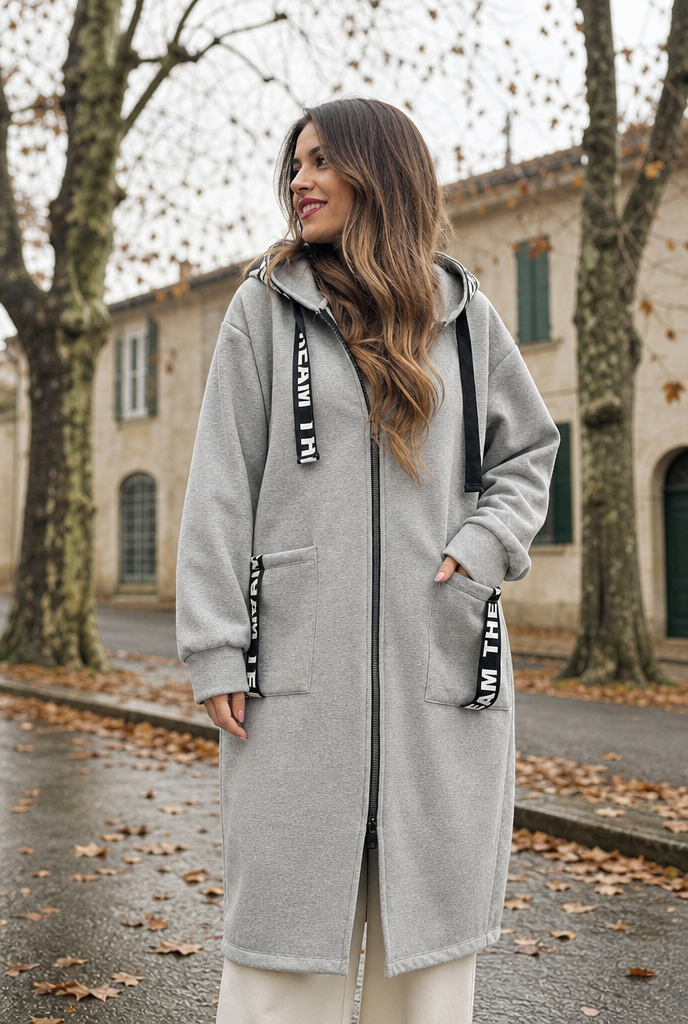 Woman in a zip-through sweatshirt jacket on an autumn street